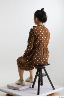 Aera  1 brown dots dress casual dressed sitting white…